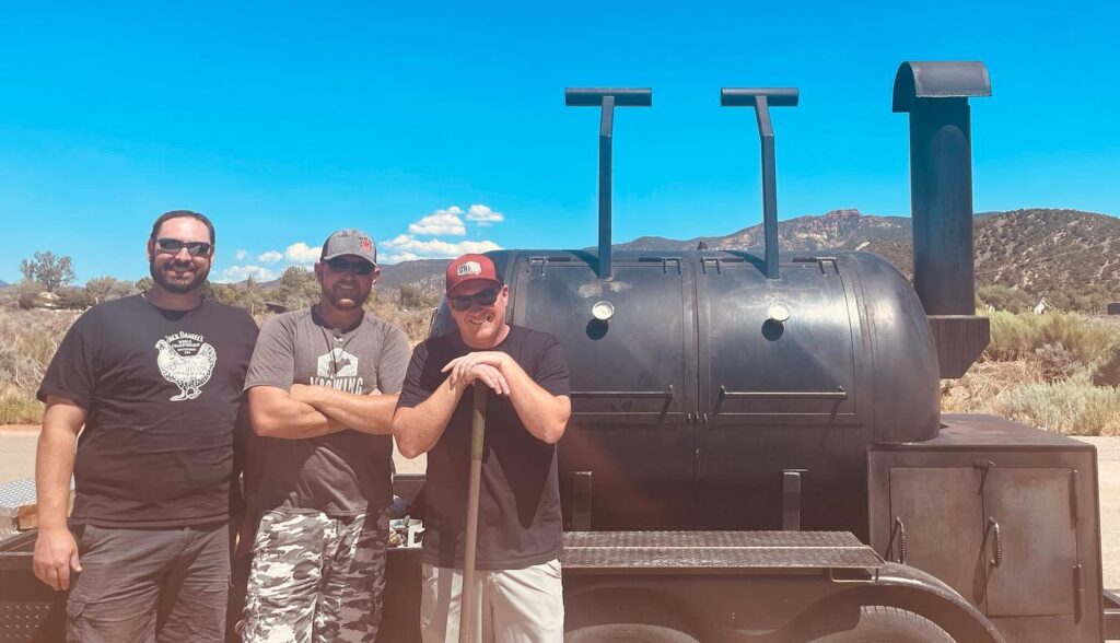 Workers in front of smoker